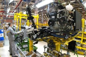 Production worker using a machine