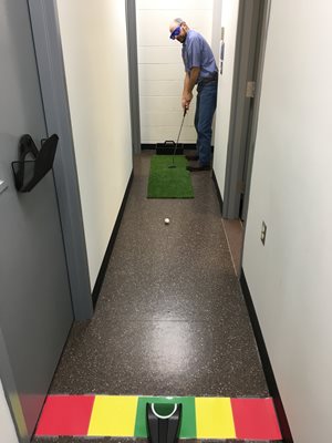 person playing mini golf at home 